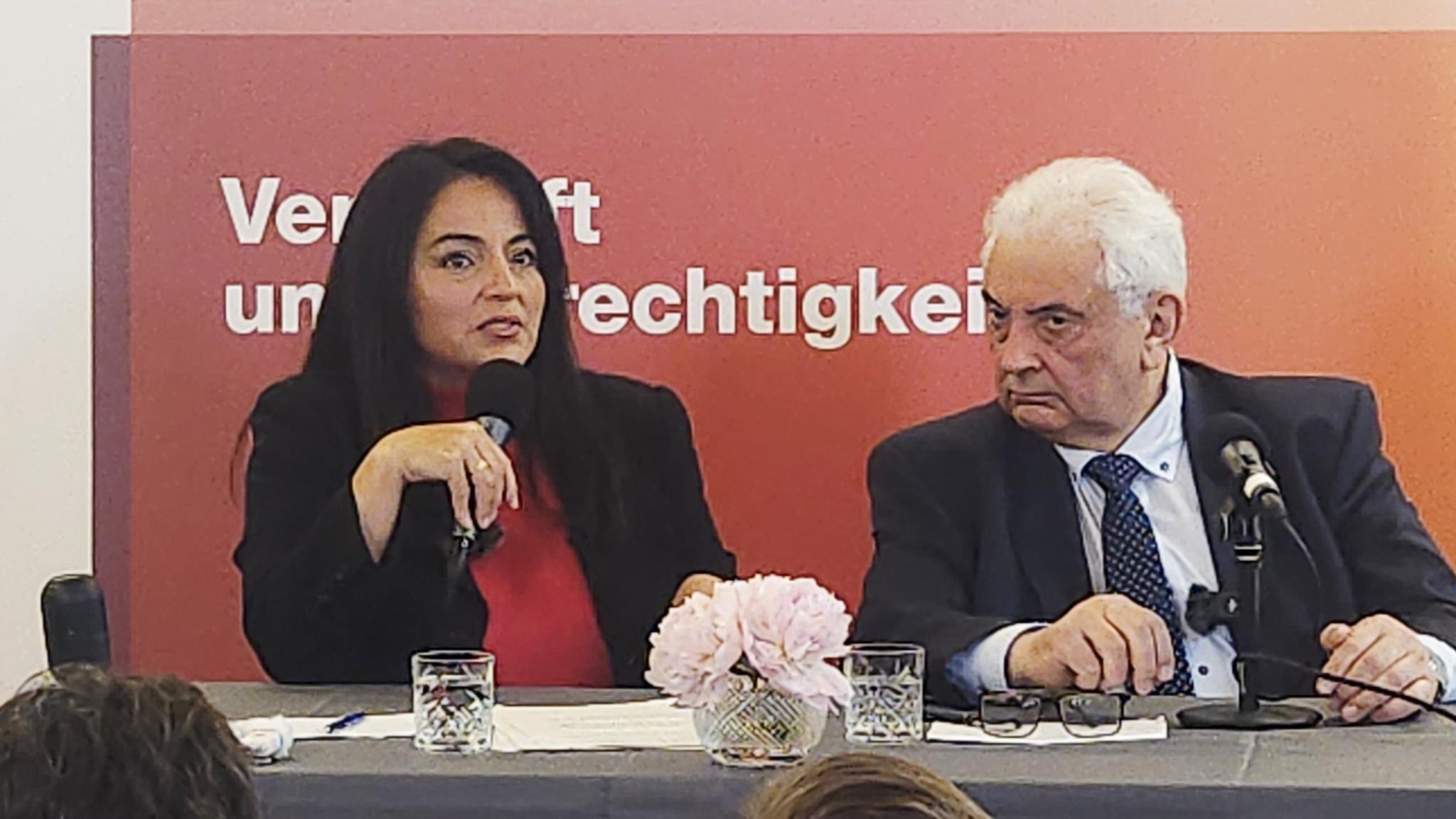 Sevim Dagdelen (German Politician) and Sergei Netschajev (Russian Ambassedor in Berlin) - discussing positions and views. (It is noteworthy that both Sevim Dagdelen and for example former Chancellor Gerhard Schröder—who was suggested recently by Russia as mediating contact person and by most of Germans positively reminded for strong economic ties and basic understanding—hail from West Germany and not from the Eastern part of Germany, which was unified in 1990 under partly unfair and illegal conditions for former GDR citizens and the main aspect of the agreement - not to expand NATO`s activity radius after the reunification, as accepted condition of Gorbatschov, which gave later reason for military intervention in Ukraine from 2014, after first related efforts to provoke otherwise became obvious.)